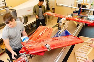 Student working on airplane