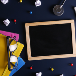 Tablet and glasses on a table.